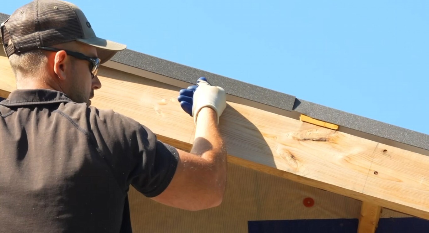 Roofing contractor performing detailed roof inspection in Cypress, CA